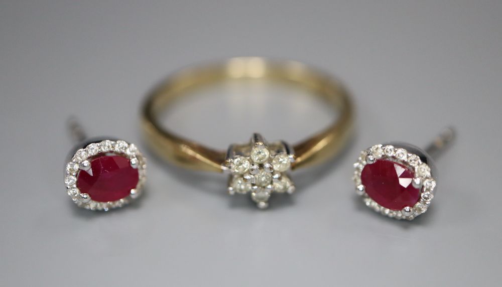 A pair of ruby and diamond cluster earrings, 18ct white gold setting and a 9ct yellow gold and diamond flowerhead cluster ring